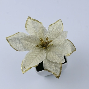 Detail of champagne gold artificial Poinsettia with mesh petals and glitter in a white pot