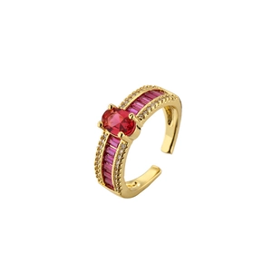 Adjustable gold ring featuring oval red zircon and baguette gems on a minimalist band