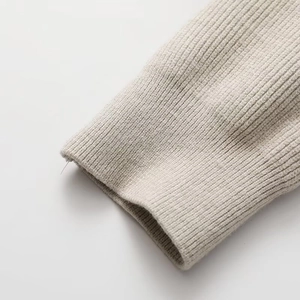 Detail of ribbed knit cuffs on women winter jacket featuring high-elastic oatmeal fabric