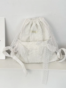 White lace drawstring backpack for women featuring delicate floral patterns and bow details