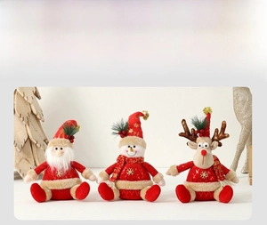 Detail of plush Christmas figurines featuring Santa, snowman, and reindeer in red and gold