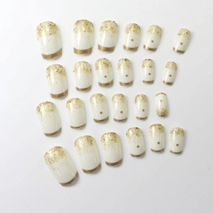 Luxus 24er Set weiß-goldene Ombré-Kunstnägel mit Stern-Akzenten und Glitzerspitzen