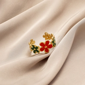 Adjustable gold flower open ring with red and green enamel on champagne silk fabric