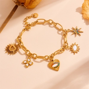 Detail of gold stainless steel bracelet featuring diverse charms with colorful stones