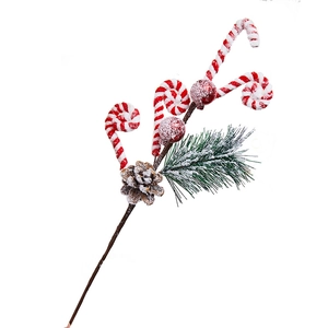 Artificial Christmas pine branch with red white candy canes and snowy pine cones