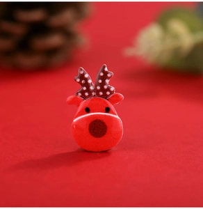 Macro shot of a red resin reindeer miniature for DIY Christmas crafts and decor