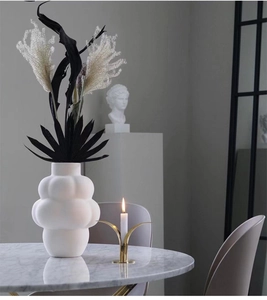 Detailed close-up of matte white ceramic bubble vase with unique textured surface
