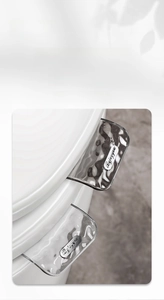 Close-up of the transparent PET toilet seat lifter with a stylish water ripple design