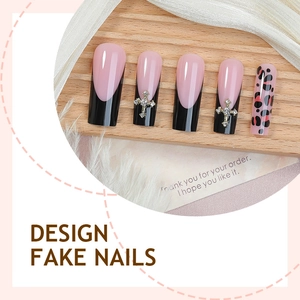 Long coffin press-on nails featuring French tips, leopard print, and silver metal crosses