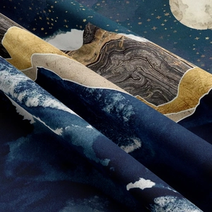 Detailed close-up of high-quality mountain tapestry fabric with celestial patterns