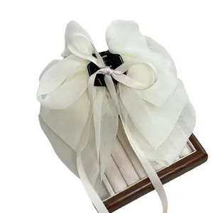 Elegant white organza bow hair claw clip with layered chiffon design for voluminous hair