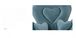 Detailed view of the smooth heart-shaped Dutch velvet cushion texture and soft fabric
