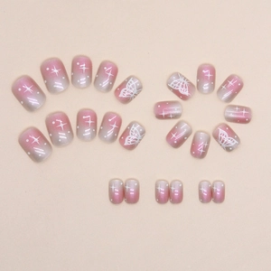 Pink and gray ombre press-on nails set with butterfly and star patterns in glossy finish