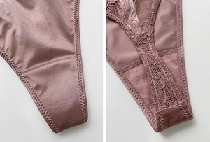 Close-up of pink satin and lace splicing texture on high-waist rhinestone thong