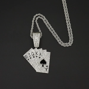 Macro view of iced-out silver playing cards pendant showing Royal Flush details
