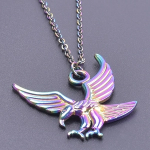 Macro shot of eagle pendant necklace featuring a vibrant rainbow electroplated finish