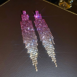 Close-up of sparkling pink gradient rhinestone tassel earrings with a starlight shine effect