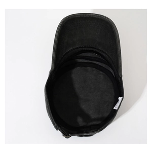 Detail of internal cotton lining, sweatband and washing label of washed black cadet cap