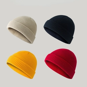 Unisex short knit beanie hats shown in beige, navy blue, yellow and red colors