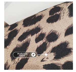 Macro shot of leopard print fabric showing the suede texture of the child's bag