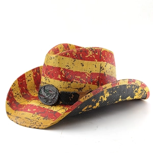 Detail of western straw cowboy hat with American flag stripes and metal eagle badge