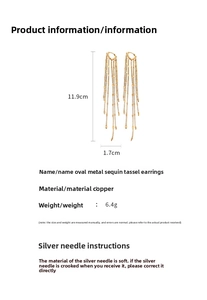Detailed view of long gold tassel earrings with oval sequins and copper chain design