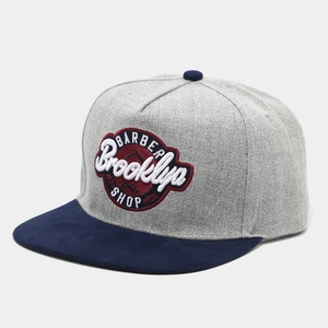 Flat brim baseball cap in grey and navy blue with Barber Brooklyn embroidery