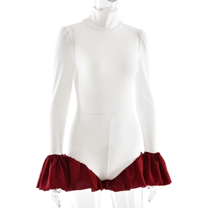 Detail of white turtleneck bodysuit featuring contrasting deep red ruffled flare sleeves
