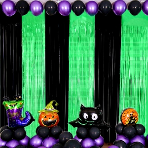 Detail of St. Patrick's Day fringe curtain backdrop with black and green party balloons