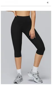 Detailed close-up of high-waist yoga shorts in premium black with moisture-wicking fabric