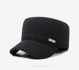 Close-up of black wool flat top military cap for men with golden fashion logo detail