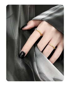 Detail of two-tone sterling silver rings with lava texture and pavé zircon stones