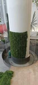 Detail view of the water pump and internal irrigation system for artificial moss fountain