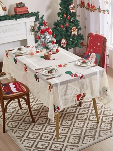 Detailed Christmas tablecloth with Santa Claus embroidery and festive lace border
