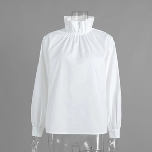 Detail of elegant white high neck blouse with pleated ruffled collar and puffed sleeves