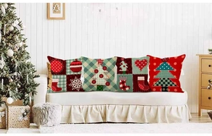 Close-up of four Christmas tree pillow covers with linen texture on a cozy sofa