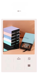 Detail of drawer-style jewelry box with transparent PE film showing a leopard pendant