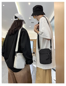 Couples wearing black and white nylon crossbody bags in a modern casual style