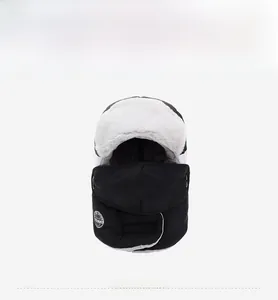 Close-up of winter trapper hat with thick white fleece lining and detachable face mask
