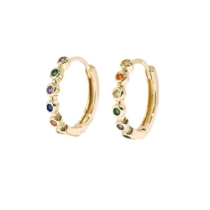Close-up of golden hoop earrings featuring colorful inlaid crystals on a white background