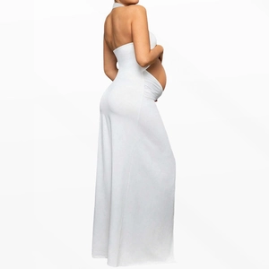 Side view of white maternity photoshoot gown showing elegant drape and body curves