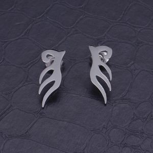 Polished stainless steel angel wing stud earrings displayed on black textured background