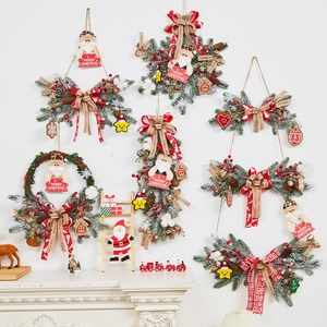 Christmas rattan wreath and teardrop garland set with Merry Christmas signage on a wall