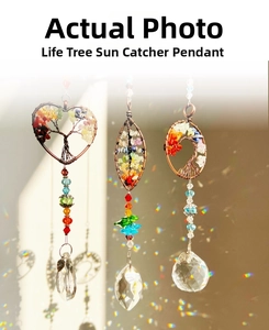 Macro detail of three Tree of Life suncatchers with colorful stones and crystal prisms