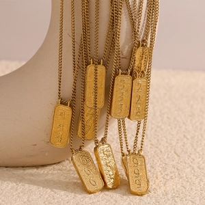 18K gold plated stainless steel necklaces with embossed number tarot pendants on display