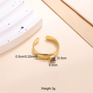 Detail view of 18k gold plated ring featuring purple zircon and bead textured band