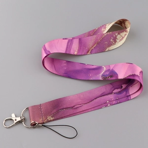 Detailed view of marble pattern neck lanyard with silver metal hook and loop