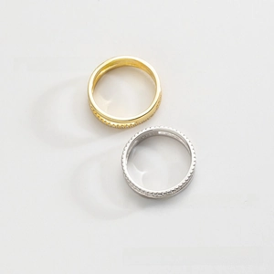 Close-up of S925 sterling silver rings with micro-paved zircons in gold and silver finish