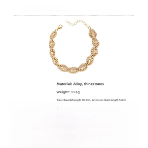 Detailed view of luxury gold-toned geometric bracelet with sparkling pave zircon stones