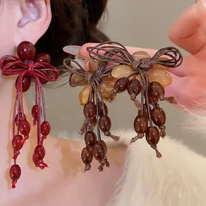 Elegant retro resin bow tassel earrings with amber and dark red beads for women
